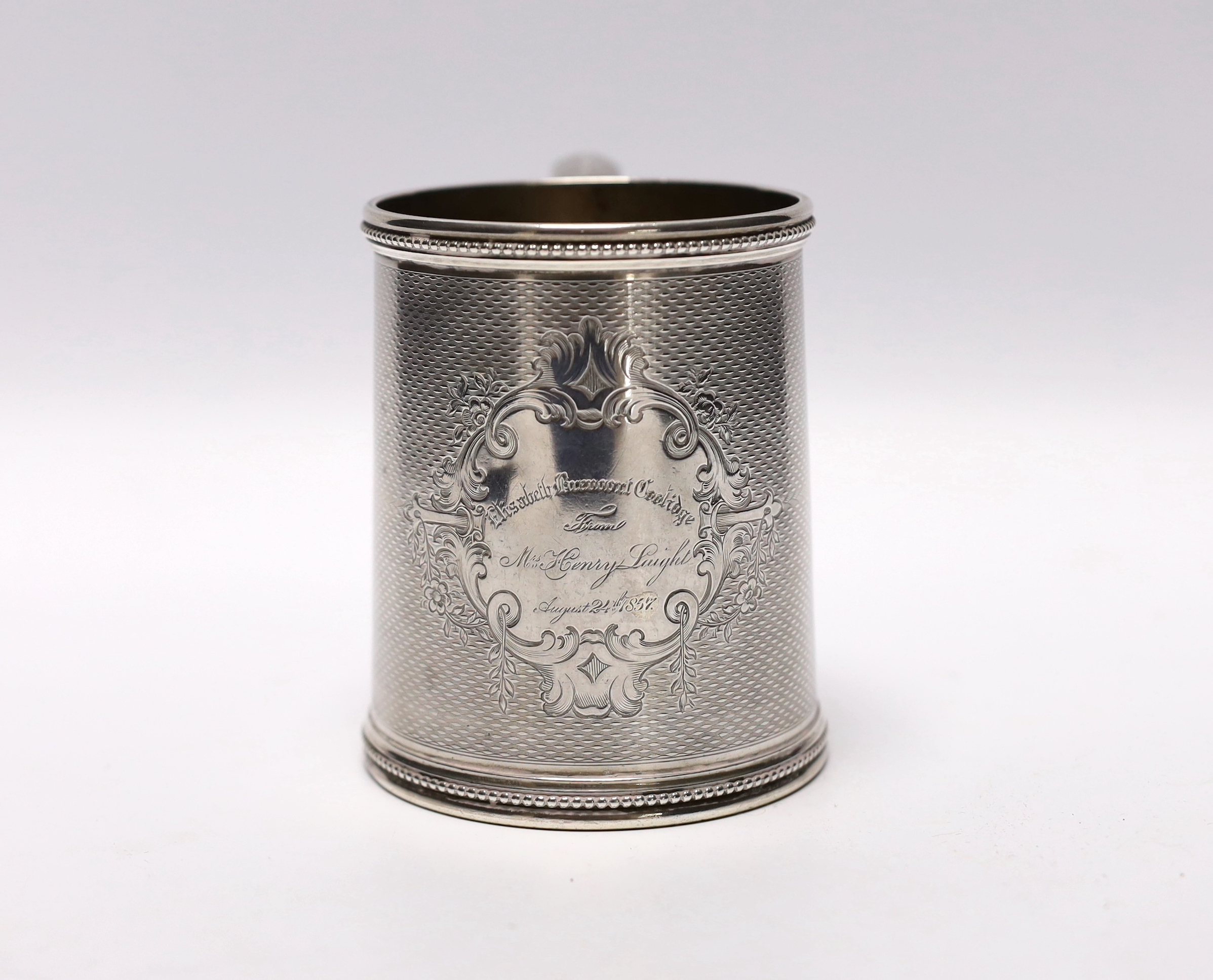 A mid 19th century Tiffany & Co (Grosjean & Woodward) engine turned sterling mug, with engraved inscription, 97mm, 6.9oz.